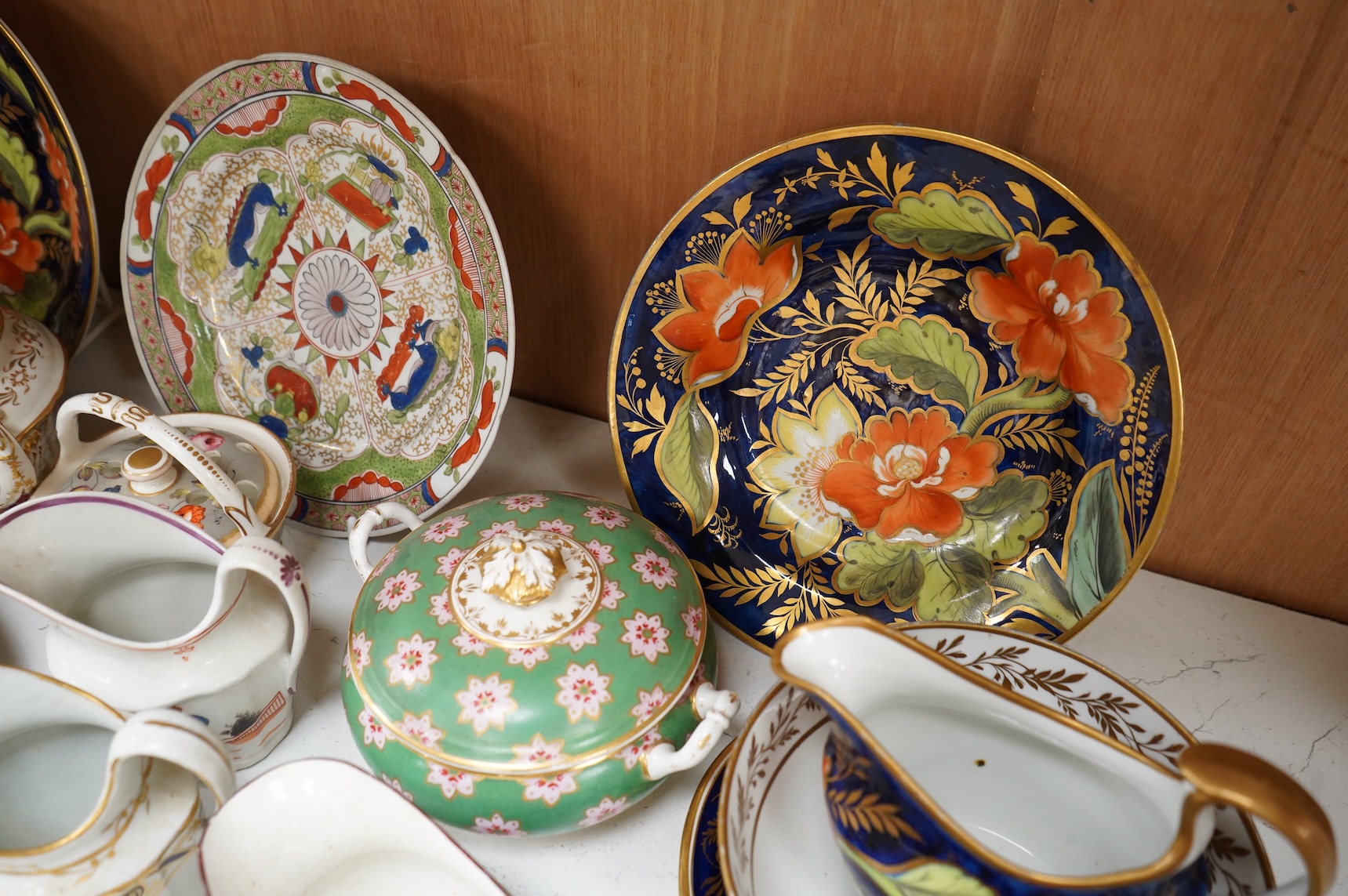 A collection of early 19th century English porcelain tea, dessert and dinner wares including Derby dessert plates, Bloor Derby, Barr Flight & Barr plate, Spode, Coalport etc.